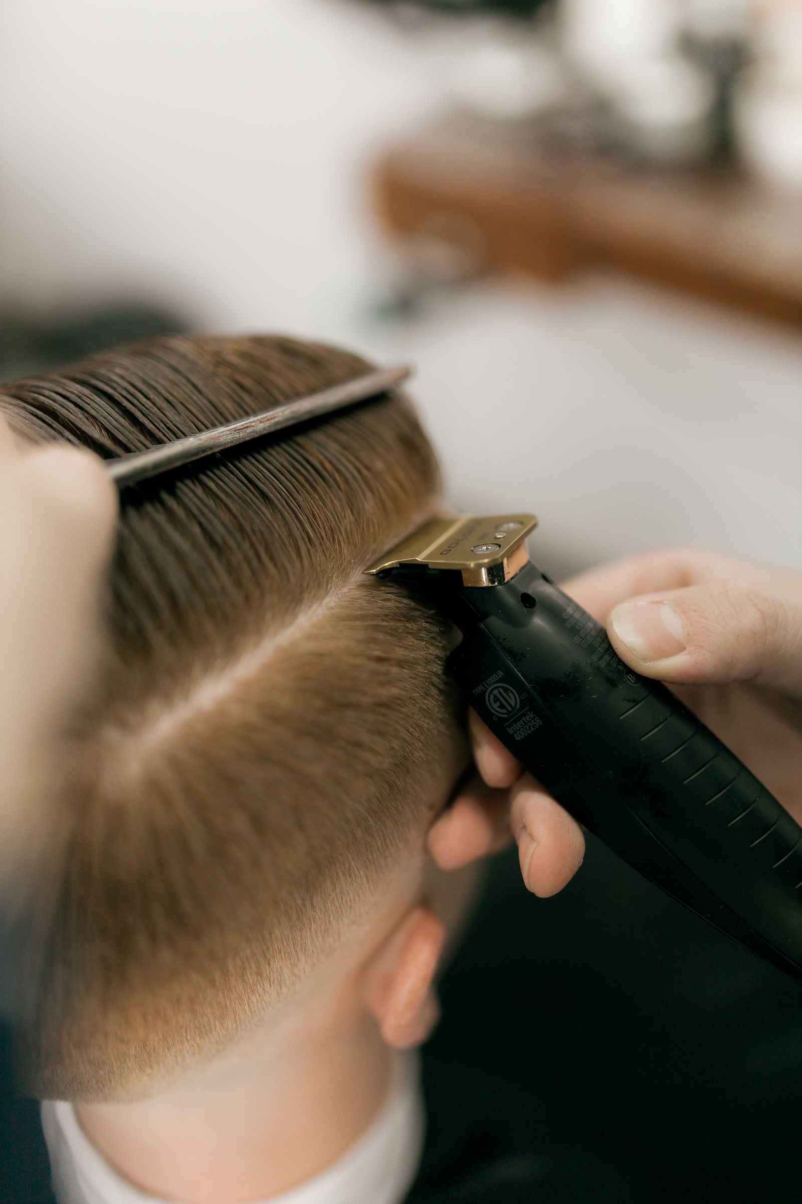 Brass trimmer detailing a fade